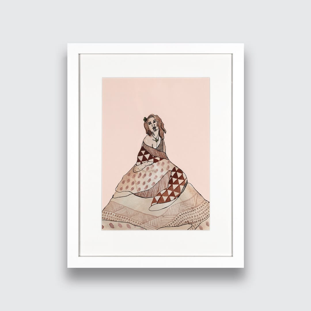 A framed art print featuring a stylized illustration of a Maori woman in a patterned dress on a pale pink background, presented in a white frame against a light gray wall.