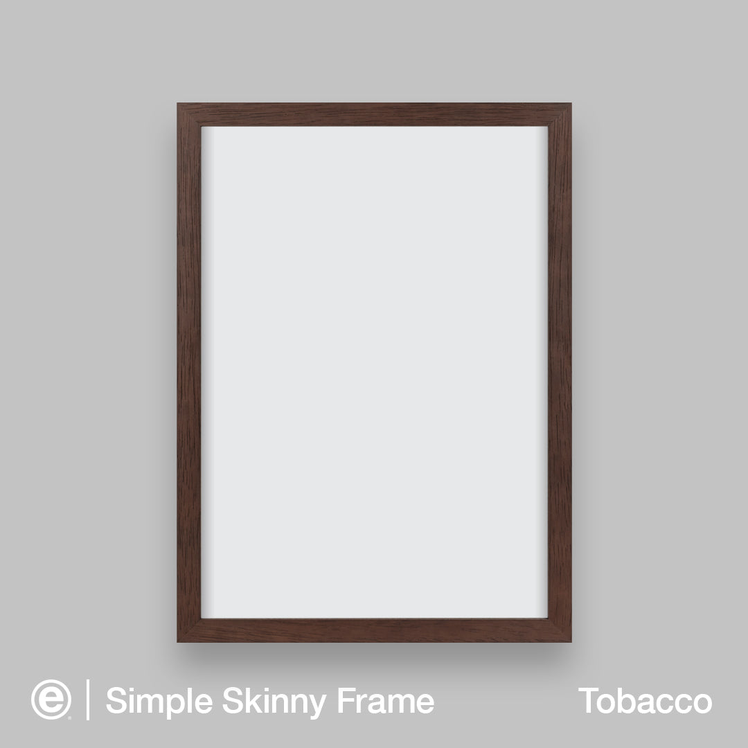 A vertical skinny picture frame in a tobacco brown finish, shown empty against a neutral gray background. The text 'Simple Skinny Frame' and 'Tobacco' are visible at the bottom of the image.