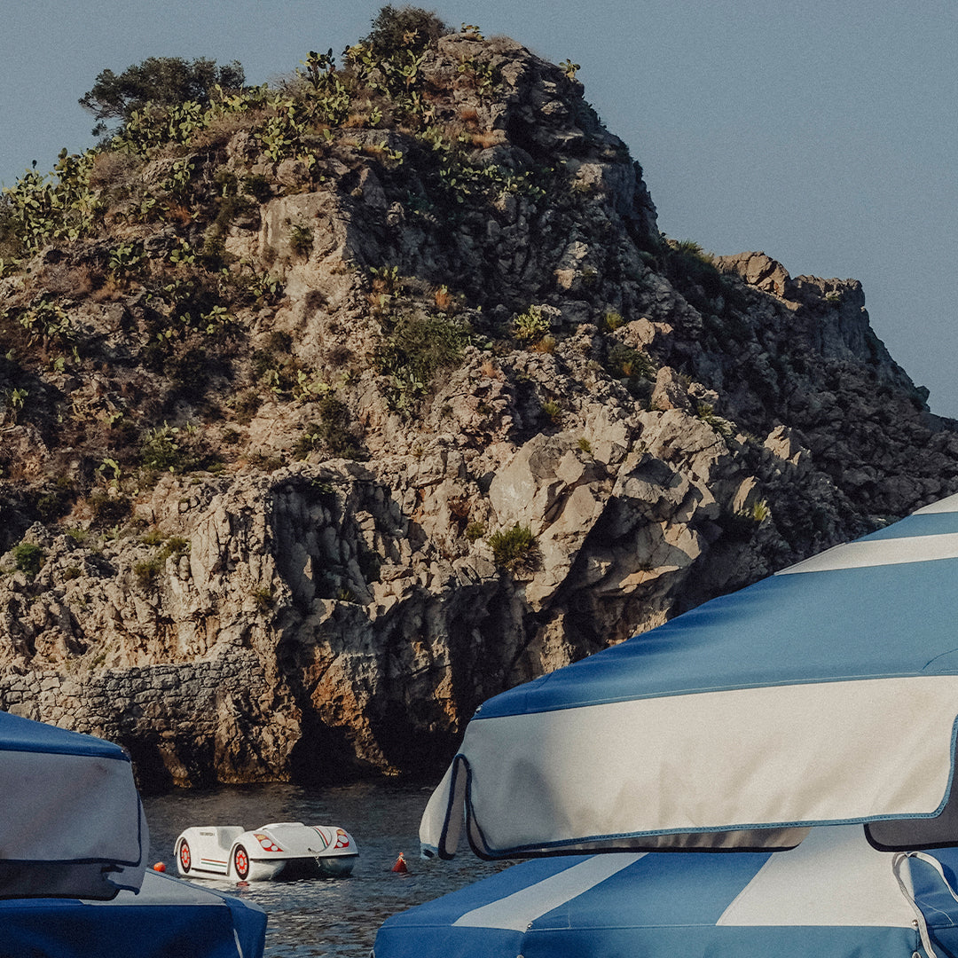 Under The Taormina Umbrellas Art Print by Jessica Higueras